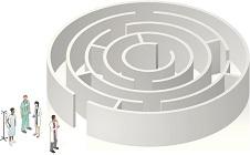 Patient and doctors stand near the entrance to a circular maze.