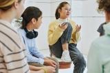 Portrait of teenage girl sharing feelings in support group circle for children