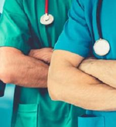 White males in scrubs, arms folded with stethoscopes